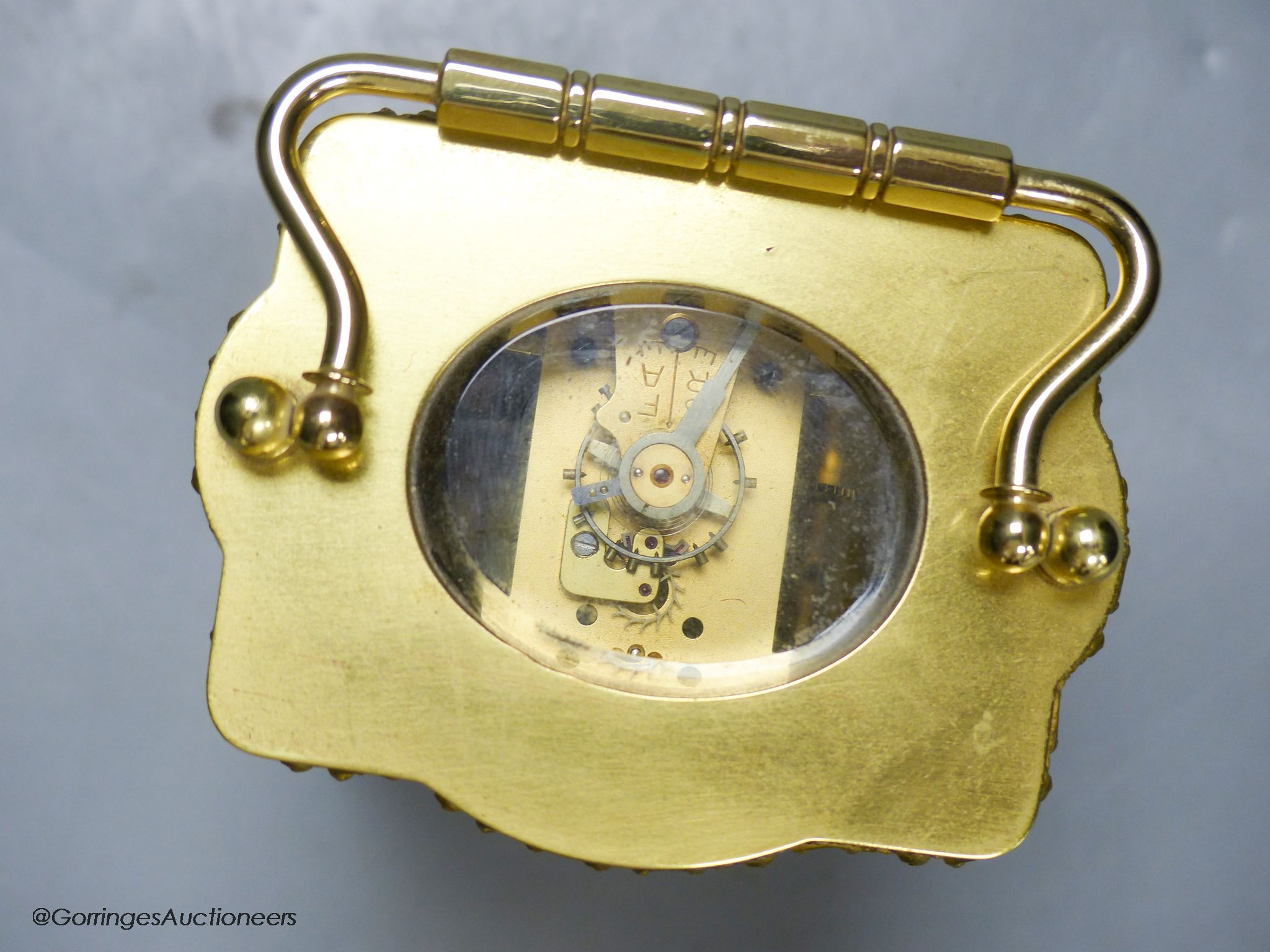 An Edwardian serpentine brass carriage timepiece, height 12cm
